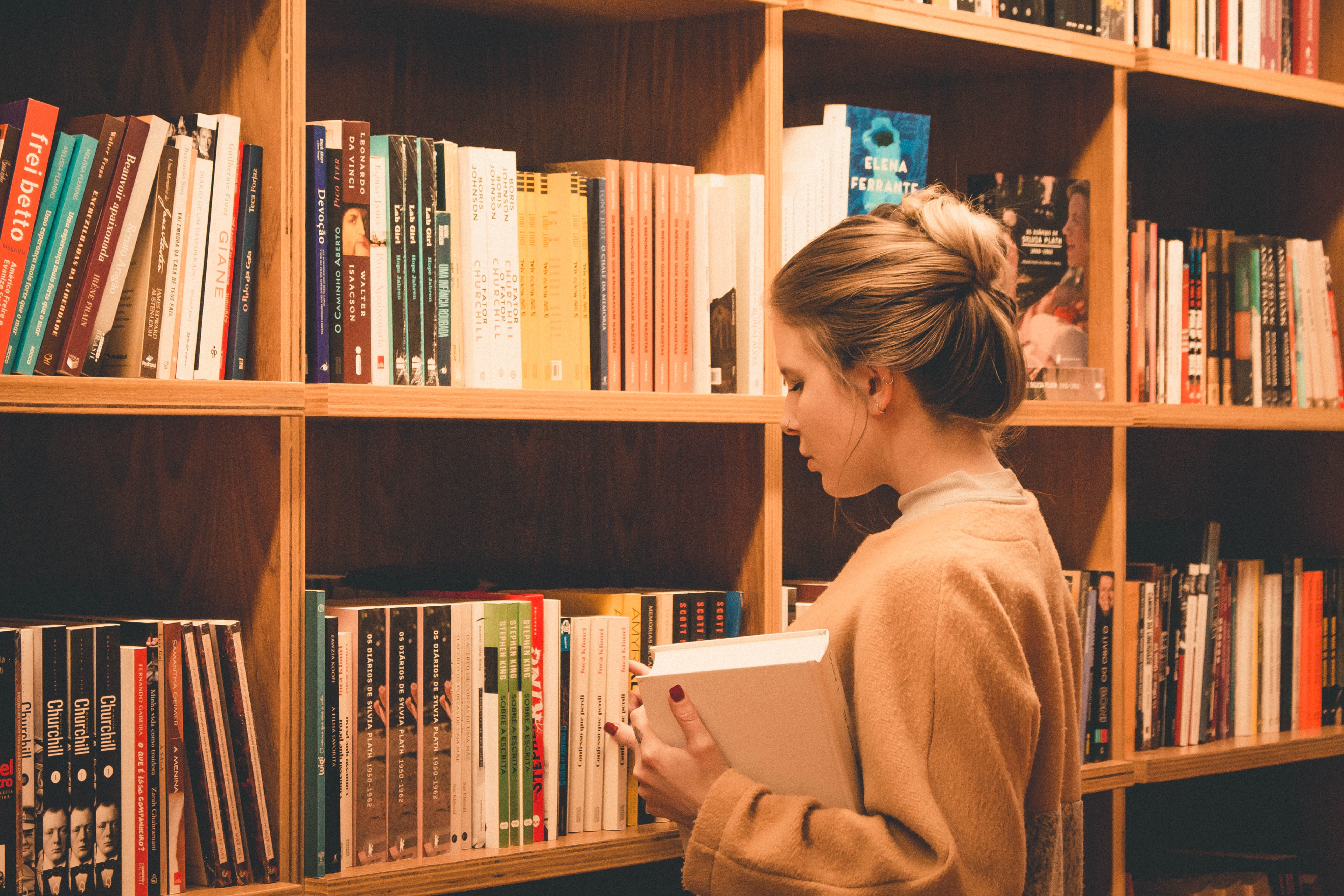 Girl looking at books